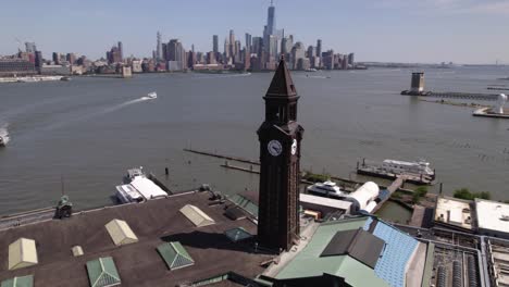 Lackawana-tower-at-the-Hoboken-Terminal-with-Manhattan-in-the-background---circling-aerial