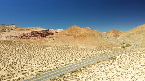 Highway-14-along-the-Midland-Trail-in-the-Mojave-Desert's-harsh-climate---aerial-view