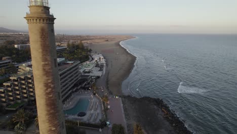 Maspalomas-lighthouse-and-resort-touristic-town-by-the-beach,-Canary-Islands