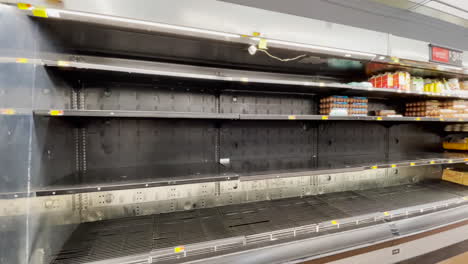 Empty-dairy-shelves-at-Walmart-grocery-store