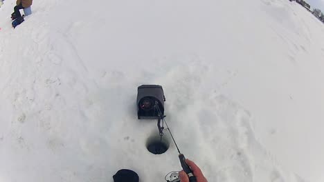 Still-Ice-Fishing-Done-By-An-Angler-With-Fish-Finder-Device-On-Site