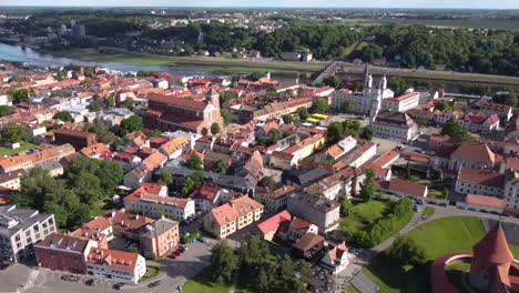 Aerial-Panorama-of-Kaunas-Old-Town,-Lithuania,-Historic-Buildings,-Church,-Cathedral,-Castle-on-Sunny-Day,-Drone-Shot-60fps