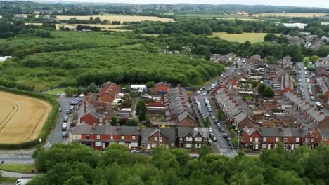 Residential-homes-aerial-view-suburban-British-town-woodland-neighbourhood
