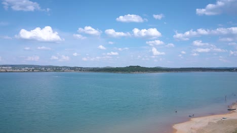 Aerial-shots-of-a-lake-park-in-Texas-on-the-popular-Canyon-Lake-while-barely-any-boats-are-cruising-around