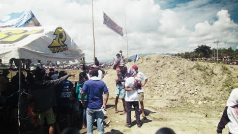 Crowds-gathered-nearby-the-race-track-as-the-motocross-competition-is-about-to-start