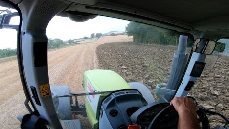 Tractor-driver's-cockpit-pov-plowing-agricultural-fields