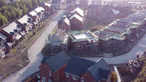 Aerial-view-above-suburban-townhouse-framework-on-development-construction-site