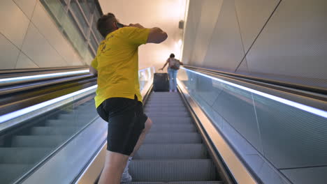 People-going-up-on-escalator-at-airport
