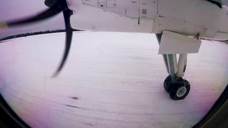 Sioux-Lookout-Ontario-Northern-Canada,-airplane-take-off-time-lapse,-snowy-small-gravel-airport-northern-Canada-Winter