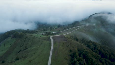 Aerial-footage-taken-before-sunrise-in-the-countryside-of-Transylvania-while-flying-over-a-stone-road