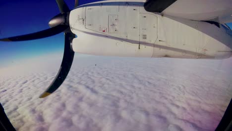 Sioux-Lookout-Ontario-Northern-Canada,-airplane-above-clouds-time-lapse,-snowy-small-gravel-airport-northern-Canada-Winter