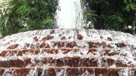 Water-falls-down-in-cascade-fountain