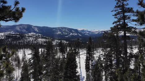 Drone-shot-of-snowy-mountains-in-tahoe-sierra-mountains