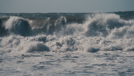 Slow-motion-large-waves-crashing-in-Half-Moon-Bay,-California
