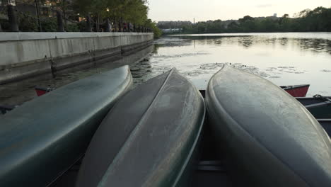 Canoes-at-dusk-on-the-Charles-River-in-Waltham,-MA