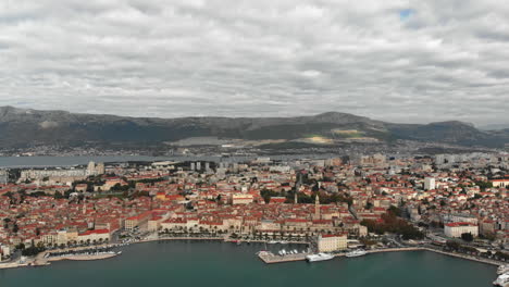Drone-slowly-turning-around-a-big-Croatian-city-skyline-on-the-Adriatic-coast