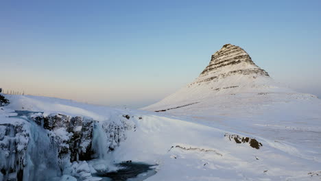 Beautifull-Kirkjufell-in-winter-Iceland-with-Kirkjufellfoss-as-a-foreground