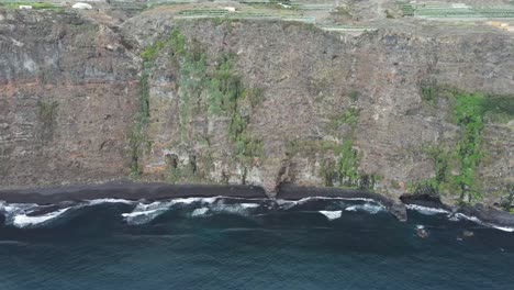 Drone-aerial-view-of-cliffs-and-black-beaches-in-the-rocky-coastline-of-La-Palma,-Canary-Islands
