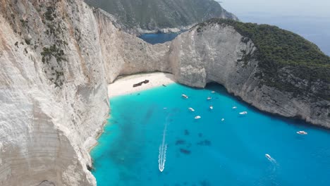 Aerial-flight-over-the-Navagio-bay-and-Ship-Wreck-beach-in-Zakynthos-island,-Greece