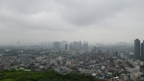 Aerial-shot-flying-high-over-Seoul-city-skyline-in-South-Korea