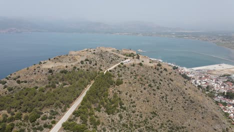 Aerial-drone-video-of-medieval-Venetian-fortress-of-Palamidi-built-uphill-in-historic-greek-town-of-Nafplio,-Greece,-Europe