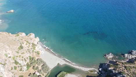 Aerial-view-of-Preveli-paradise-palm-beach-in-the-island-of-Crete,-Greece