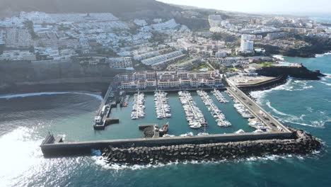 Aerial-view-of-the-port-in-the-coastal-town-of-Los-Gigantes,-Tenerife,-Canary-Islands