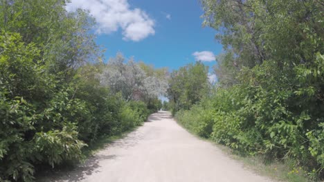Fort-Whyte-Gravel-forest-path-walk-along-on-sunny-summer-day-Winnipeg-Manitoba-Canada
