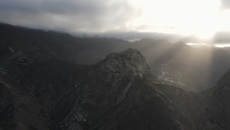 Footage-of-sun-rays-through-clouds-illuminating-a-rocky-mountain-on-the-volcanic-island-of-Tenerife