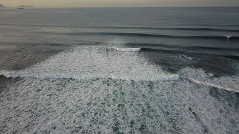Aerial-View-of-Ocean-Splashing-Waves,-Dark-Blue-Wavy-Sea-Waters-with-White-Foam---drone-shot