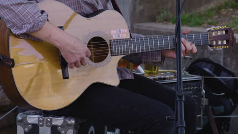 Classical-guitar-played-at-Dogwood-Festival-in-Siloam-Springs,-AR,-medium-shot
