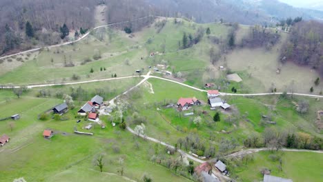 Top-view,-flying-over-idyllic-villa-area-early-in-spring