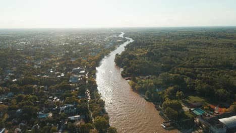 Aerial-establishing-shot-of-Luján-river-path-and-Paraná-delta-near-sunset