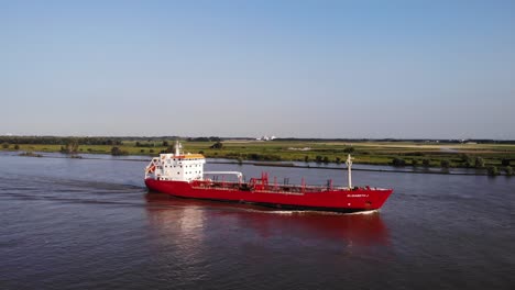 Aerial-View-Of-Elisabeth-J-Tanker-Ship-Travelling-Along-Oude-Maas-In-Barendrecht