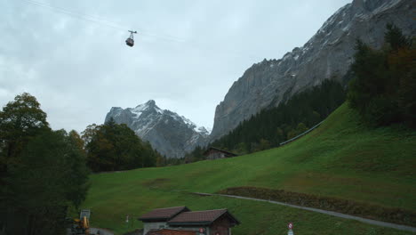 Tourist-viewpoint-of-Alps-from-below-ski-lifts-above-in-Grindelwald-Switzerland,-Europe