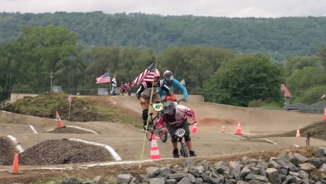 Slow-Motion-Of-Men-In-Helmet-Riding-And-Racing-On-Bicycles-During-BMX-Racing-Event
