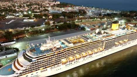 Costa-Deliziosa-luxuty-cruise-ship-moored-in-Sans-Souci-port-at-sunset,-Santo-Domingo