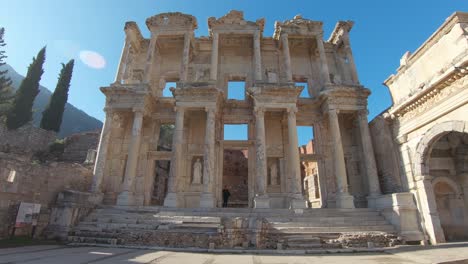 A-man-walking-at-The-Library-of-Celsus-in-Ephesus,-Turkey