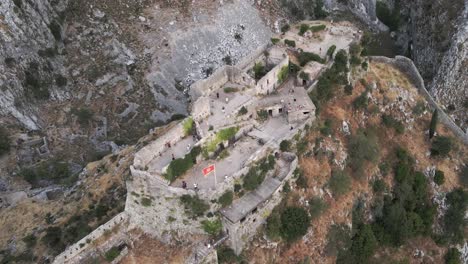 Birdseye-aerial-view-over-the-ruins-of-Castle-San-Giovanni-in-Kotor,-Montenegro