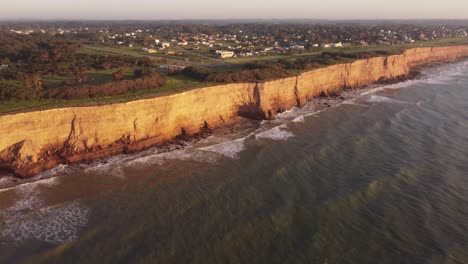 Slow-motion-cliffs-at-beautiful-sunset-in-a-panoramic-view-in-Acantilados-de-Mar-del-Plata,-Argentina