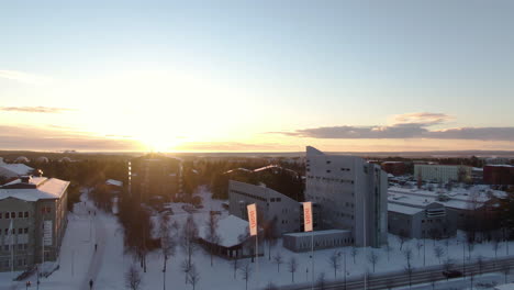 Winter-Snow-And-Sunset-Outside-the-IKSU-Sport-Restaurant,-Umea-Sweden
