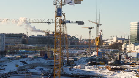 Tower-Cranes-And-Tractors-At-The-Construction-Site-Of-West-Link-Railway-Tunnel-Near-Skansen-Lejonet-In-Gothenburg,-Sweden