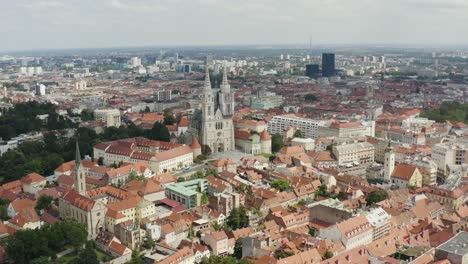 Zagreb-Cathedral-and-Historic-City-Center,-famous-landmarks-of-Capital-of-Croatia---aerial-drone-shot