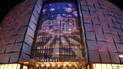 Christmas-decoration-and-screenplay-performance-on-Lotte-World-Tower-building,-Avenuel-Lotte-Dutyfree-entrance-at-night-on-New-Year-Eve
