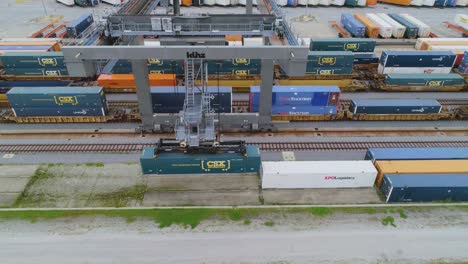 4K-Drone-Video-of-Trains-and-Trucks-at-CSX-Intermodal-Train-Yard-in-Winter-Haven,-FL