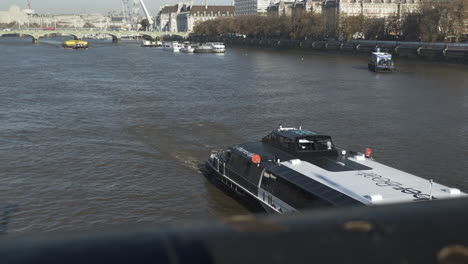 Uber-cruise-boat-floating-on-the-River-Thames-viewed-from-the-Lambeth-bridge