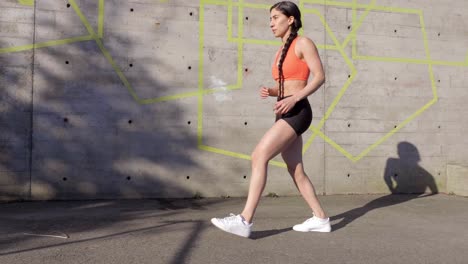 Young-athletic-woman-exercising-lunges-Wide-slow-motion-shot