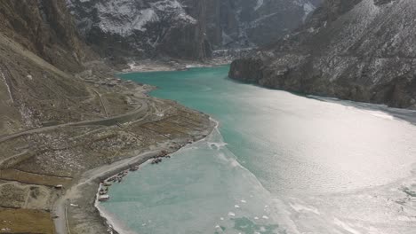 Zooming-in-aerial-shot-of-stunning-view-of-Attabad-Lake,-in-Gojal-Valley,-Hunza,-Gilgit-Baltistan,-Pakistan-by-AAH
