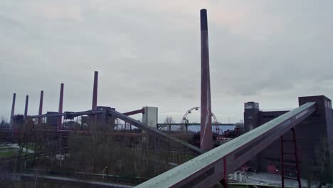 Aerial-view-of-Kokerei-Zollverein-ex-industry-complex-turned-into-a-ice-skating-range-and-tourist-attractions-activities-in-Essen,-Germany