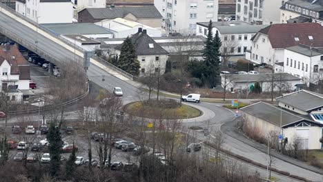 Time-lapse-of-roundabout-traffic-on-a-cloudy-day-in-Herborn,-Germany